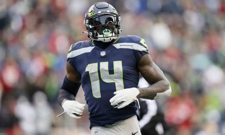 SEATTLE, WASHINGTON - DECEMBER 05: DK Metcalf #14 of the Seattle Seahawks looks on during the third quarter against the San Francisco 49ers at Lumen Field on December 05, 2021 in Seattle, Washington.