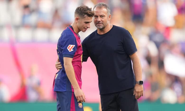 Hansi Flick, Head Coach of FC Barcelona, interacts with Fermin Lopez of FC Barcelona following the La Liga match.