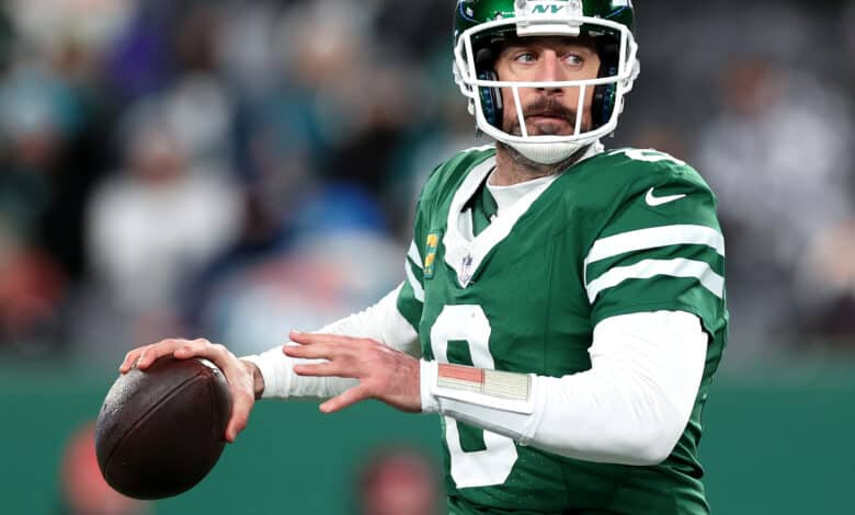Aaron Rodgers #8 of the New York Jets in action against the Miami Dolphins at MetLife Stadium