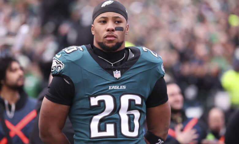 Saquon Barkley #26 of the Philadelphia Eagles stands on the field in the NFC Championship Game against the Washington Commanders