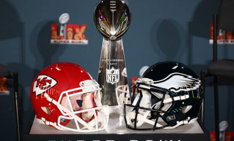 NEW ORLEANS, LOUISIANA - FEBRUARY 03: A Kansas City Chiefs helmet, the Vince Lombardi Trophy and a Philadelphia Eagles helmet are seen before the NFL Commissioner Roger Goodell's Super Bowl Press Conference ahead of Super Bowl LIX