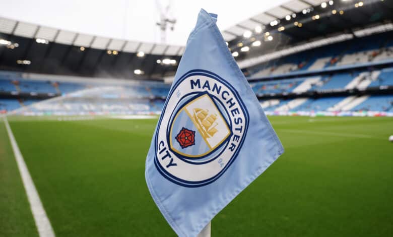 Manchester City logo on a corner flag inside the Ethiad Stadium