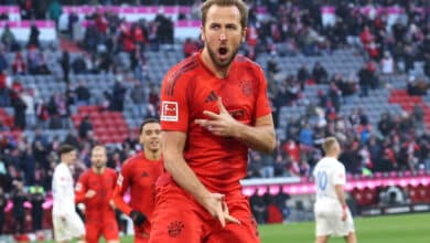 Harry Kane of Bayern Munich celebrates scoring his team's third goal during the Bundesliga match between FC Bayern München and Holstein Kiel