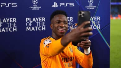 MANCHESTER, ENGLAND - FEBRUARY 11: Vinicius Junior of Real Madrid poses for a photo with his PlayStation Player of the Match trophy after the UEFA Champions League 2024/25 League Knockout Play-off first leg match between Manchester City and Real Madrid C.F. at Manchester City Stadium on February 11, 2025 in Manchester, England.