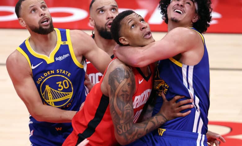 Golden State Warriors' Gui Santos and Houston Rockets'Jabari Smith, Jr. vie for rebound position in 2nd quarter during Game 1 of First Round of NBA Playoffs at Toyota Center in Houston, Texas on Sunday, April 20, 2025.