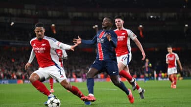 Nuno Mendes of Paris Saint-Germain is challenged by William Saliba of Arsenal during the UEFA Champions League 2024/25 League Phase MD2 match between Arsenal FC and Paris Saint-Germain Emirates Stadium at on October 01, 2024 in London, England.