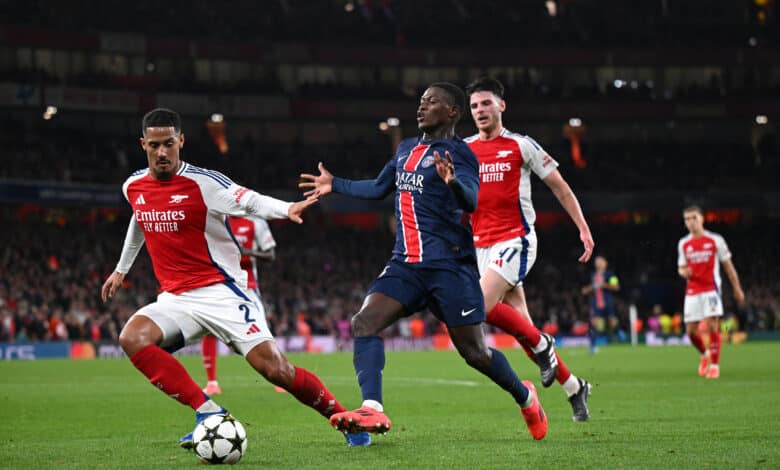 Nuno Mendes of Paris Saint-Germain is challenged by William Saliba of Arsenal during the UEFA Champions League 2024/25 League Phase MD2 match between Arsenal FC and Paris Saint-Germain Emirates Stadium at on October 01, 2024 in London, England.