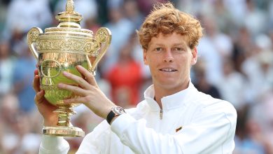 LONDON, ENGLAND - JULY 13: Jannick Sinner (ITA) [1] with the winner's trophy after winning his Gentlemen's Singles Final match against Carlos Alcaraz (ESP) [2] during day fourteen of The Championships Wimbledon 2025 at All England Lawn Tennis and Croquet Club on July 13, 2025 in London, England.