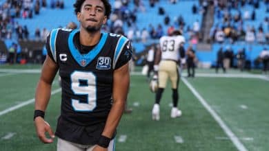 Bryce Young #9 of the Carolina Panthers runs off the field after winning his game against the New Orleans Saints