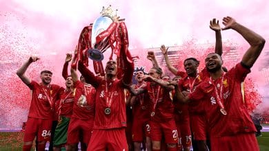 Virgil van Dijk of Liverpool, lifts the Premier League trophy