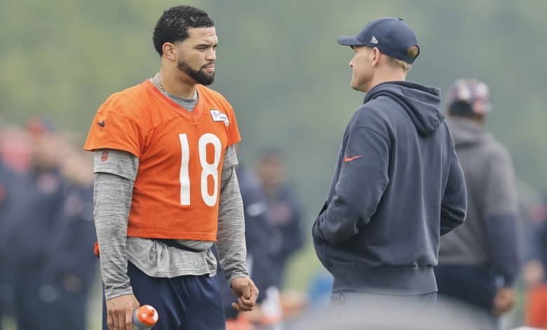 LAKE FOREST, ILLINOIS - JUNE 04: Caleb Williams #18 of the Chicago Bears talks with head coach Ben Johnson during Chicago Bears OTA Offseason Workout at Halas Hall on June 04, 2025 in Lake Forest, Illinois.