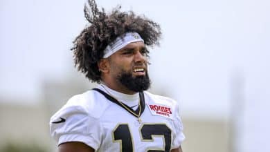 METAIRIE, LOUISIANA - JULY 24: Chris Olave #12 of the New Orleans Saints looks on from the field during a training camp practice at the Ochsner Sports Performance Center on July 24, 2025 in Metairie, Louisiana.